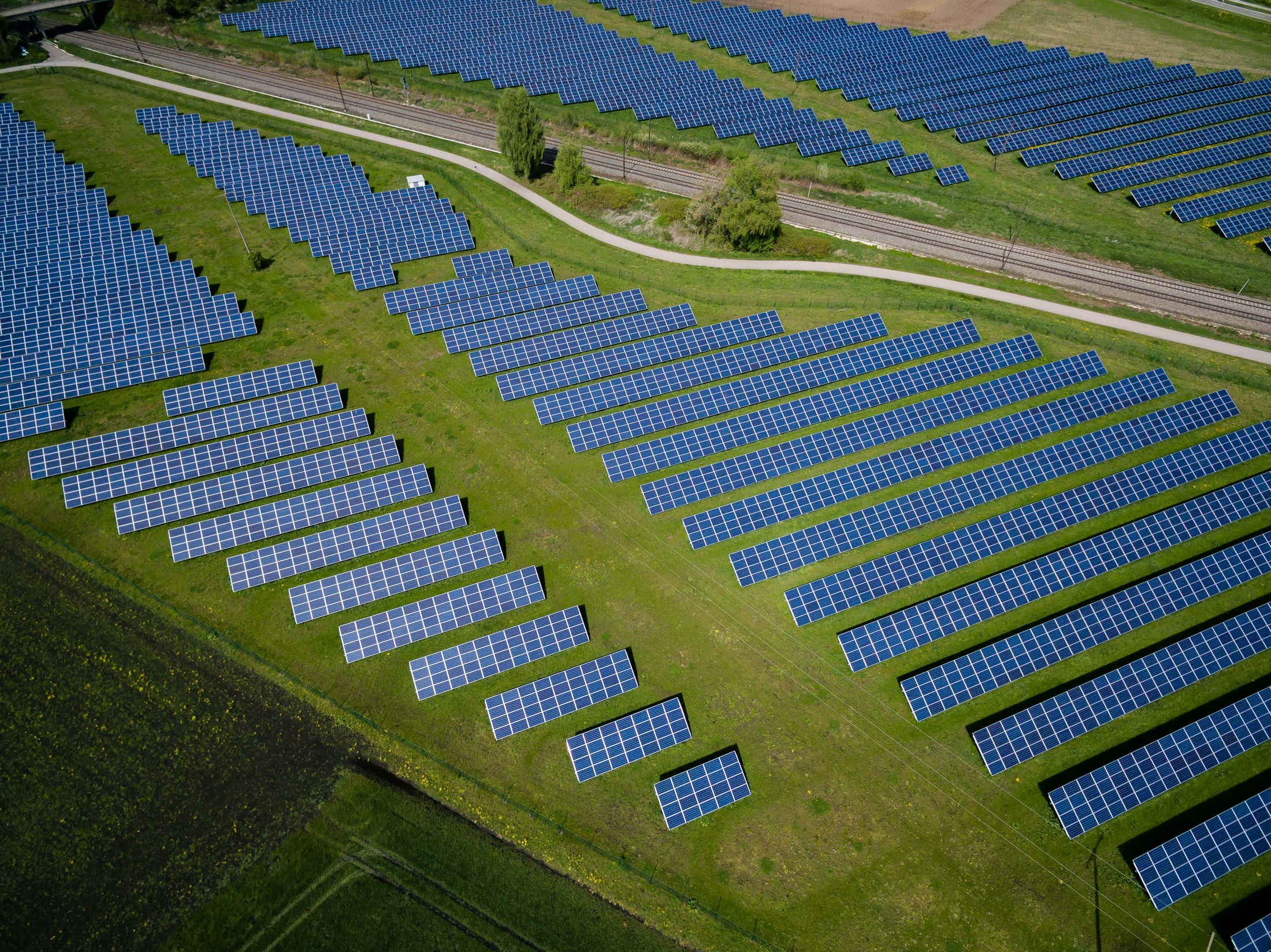 Solar panels at sunset in a clean energy field